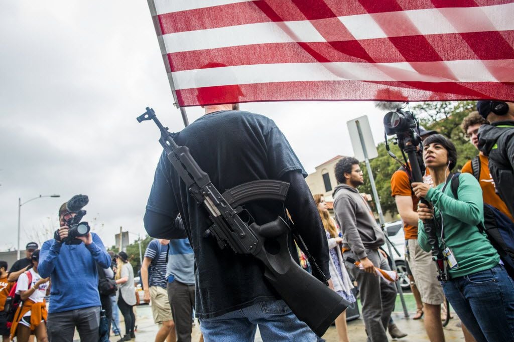 Gun activists march close to The University of Texas campus December 12, 2015 in Austin,...