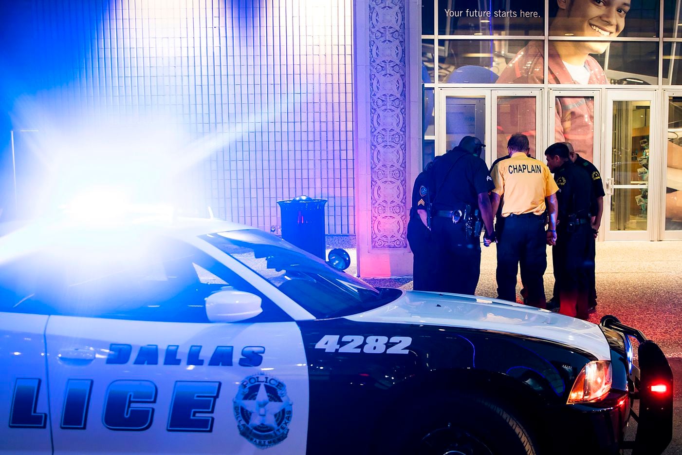 At 8:53 p.m., five minutes before the shooting began exactly one year earlier, Dallas police...