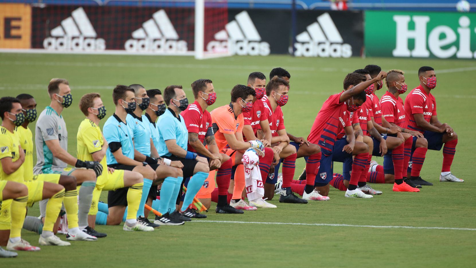 FRISCO, TX - AUGUST 12: Players of FC Dallas and Nashville SC  get to their knees during the...