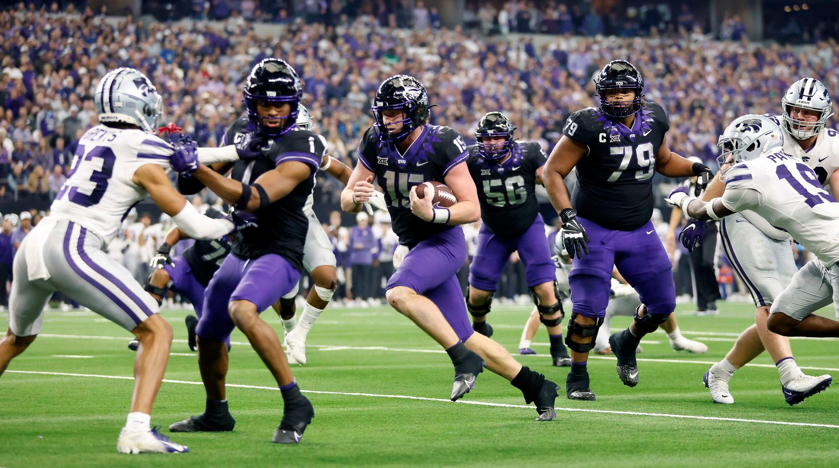 TCU Horned Frogs quarterback Max Duggan (15) keeps the ball and scores a touchdown late in...