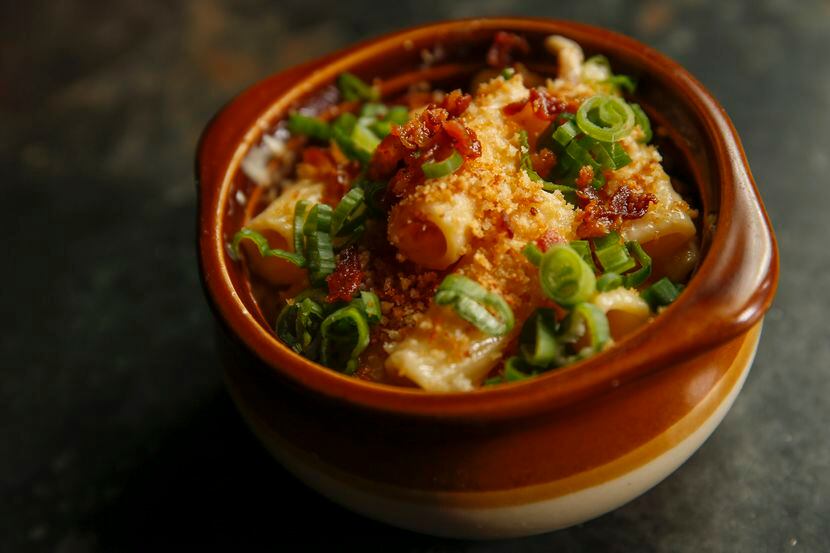 Rigatoni is topped with bacon crumbles, green onions and toasted panko breadcrumbs in Brick...