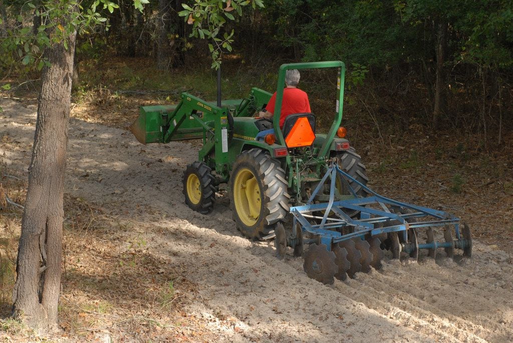 Planting cool season food plots is a big part of the game in regions of the state where rainfall is sufficient to sustain them. Using a disc to break up the ground helps provide a good bed for seeding.