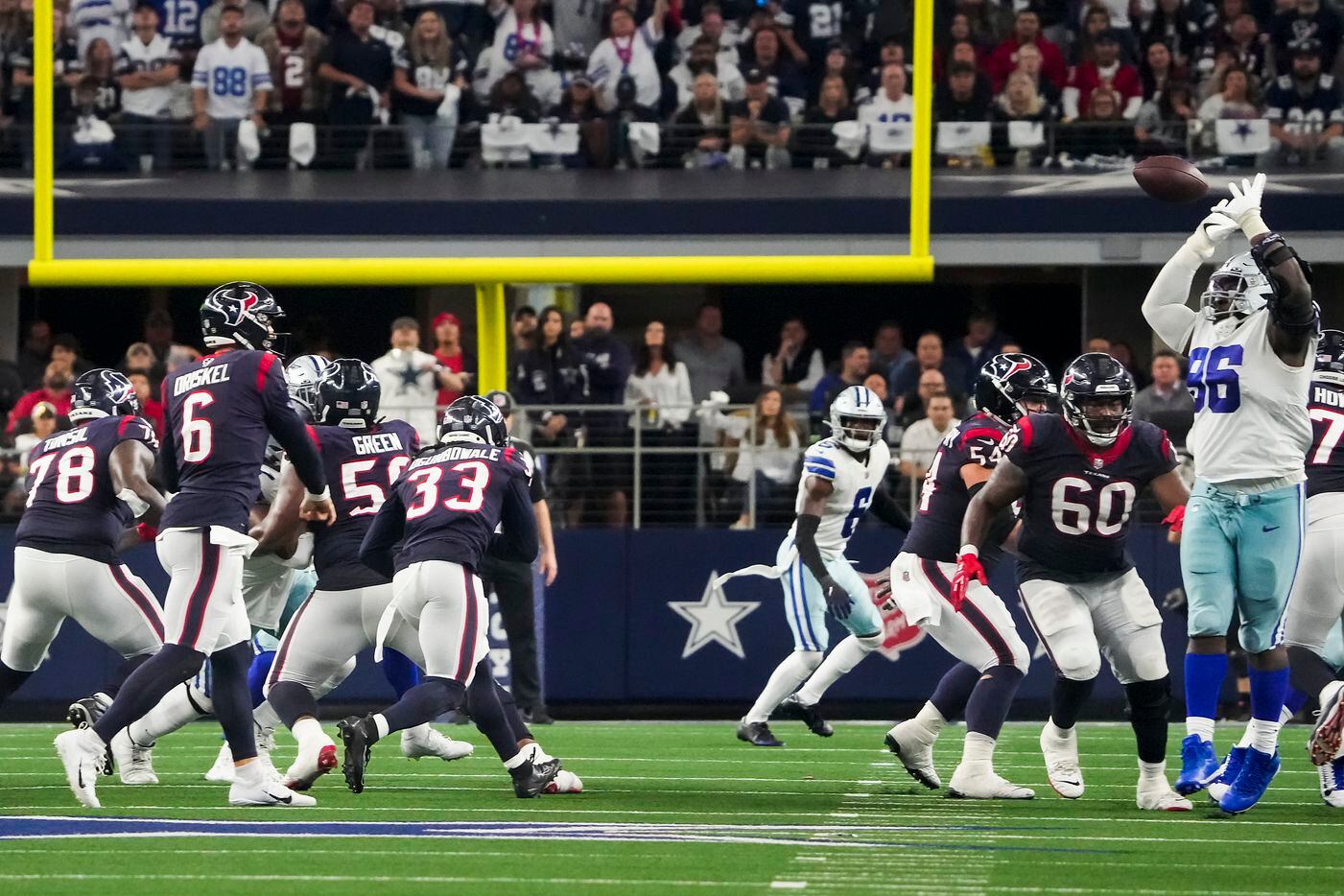 Dallas Cowboys defensive tackle Neville Gallimore (96) knocks down a pass by Houston Texans...