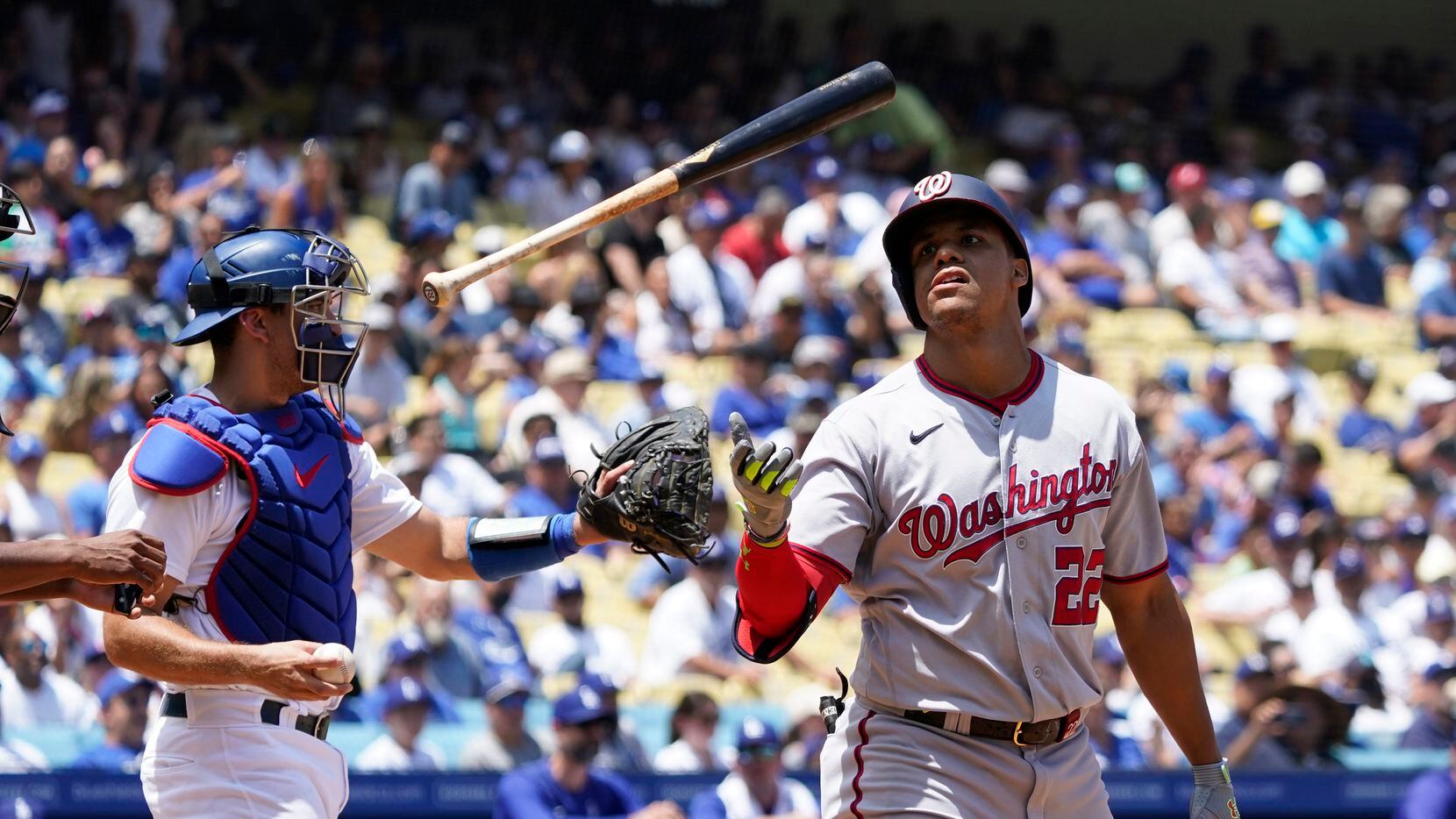 Washington Nationals' Juan Soto flips his bat after striking out during the fourth inning of...