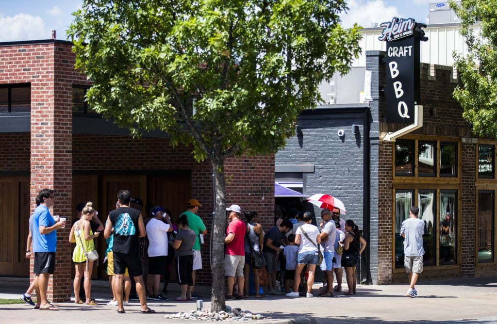 A line wraps around the block as Heim Barbecue opens a new location on Saturday, August 6,...