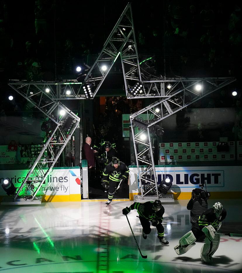 Dallas Stars goaltender Braden Holtby (70) leads his team as they take the ice before an NHL...