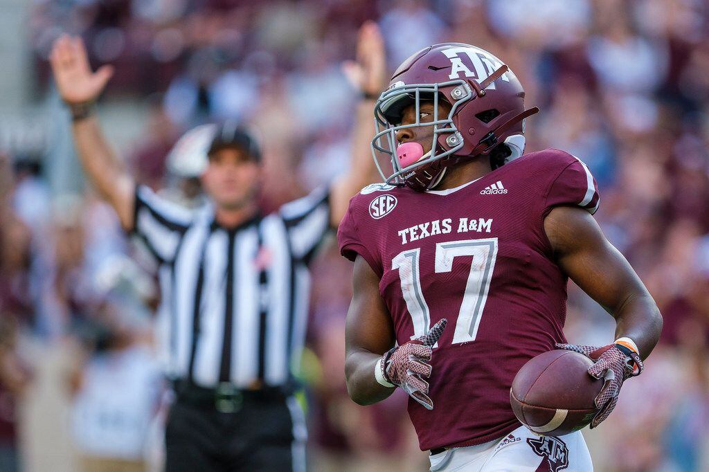 Texas A&M wide receiver Ainias Smith (17) celebrates after scoring on 15-yard touchdown...