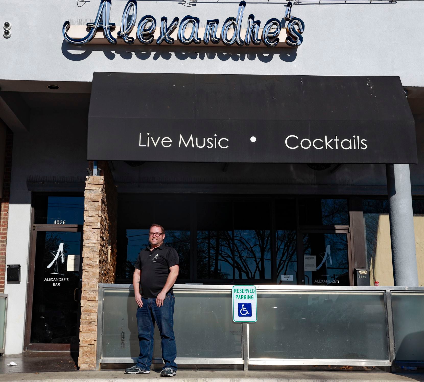 Lee Daugherty owner of Alexandre’s poses for a portrait in Dallas, Monday, Jan. 3, 2022. The restaurant is closed the month of January after an employee came down with COVID-19.