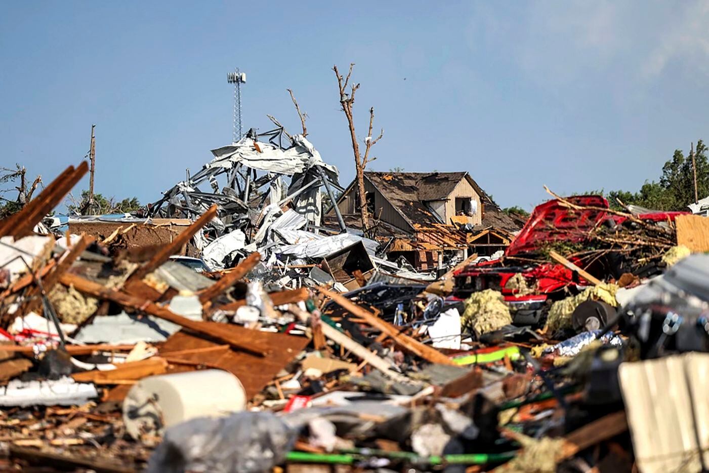 Debris covers a residential area in Perryton, Texas, Thursday, June 15, 2023, after a...