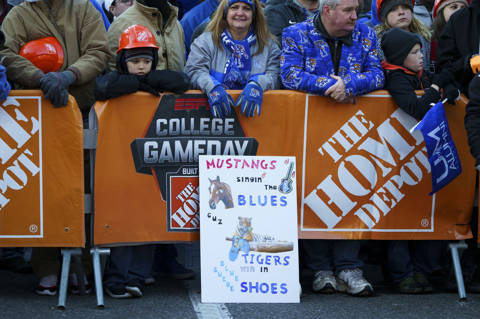 Fans crowd against a barrier during ESPN College GameDay before an NCAA football game...