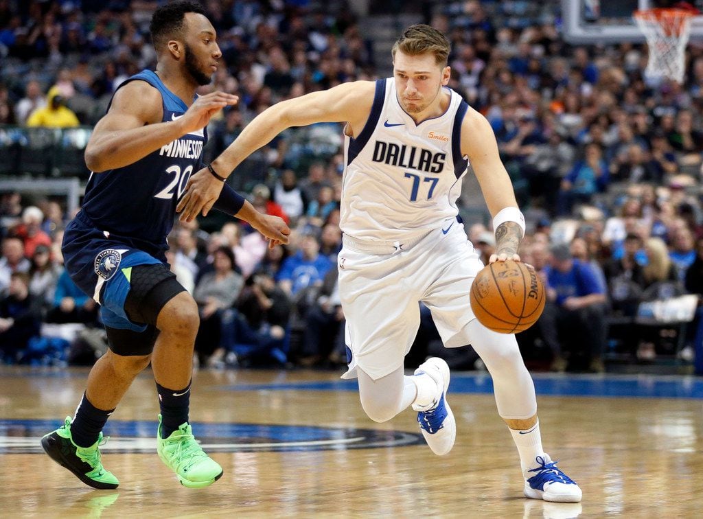Dallas Mavericks forward Luka Doncic (77) drives around Minnesota Timberwolves guard Josh Okogie (20) during the first half at the American Airlines Center in Dallas, Wednesday, April 3, 2019. (Tom Fox/The Dallas Morning News)
