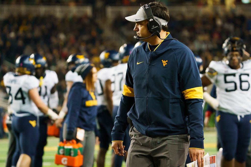West Virginia head coach Neal Brown watches during a time out during the first half of an NCAA football game against Baylor at McLane Stadium on Thursday, Oct. 31, 2019, in Waco, Texas. (Smiley N. Pool/The Dallas Morning News)
