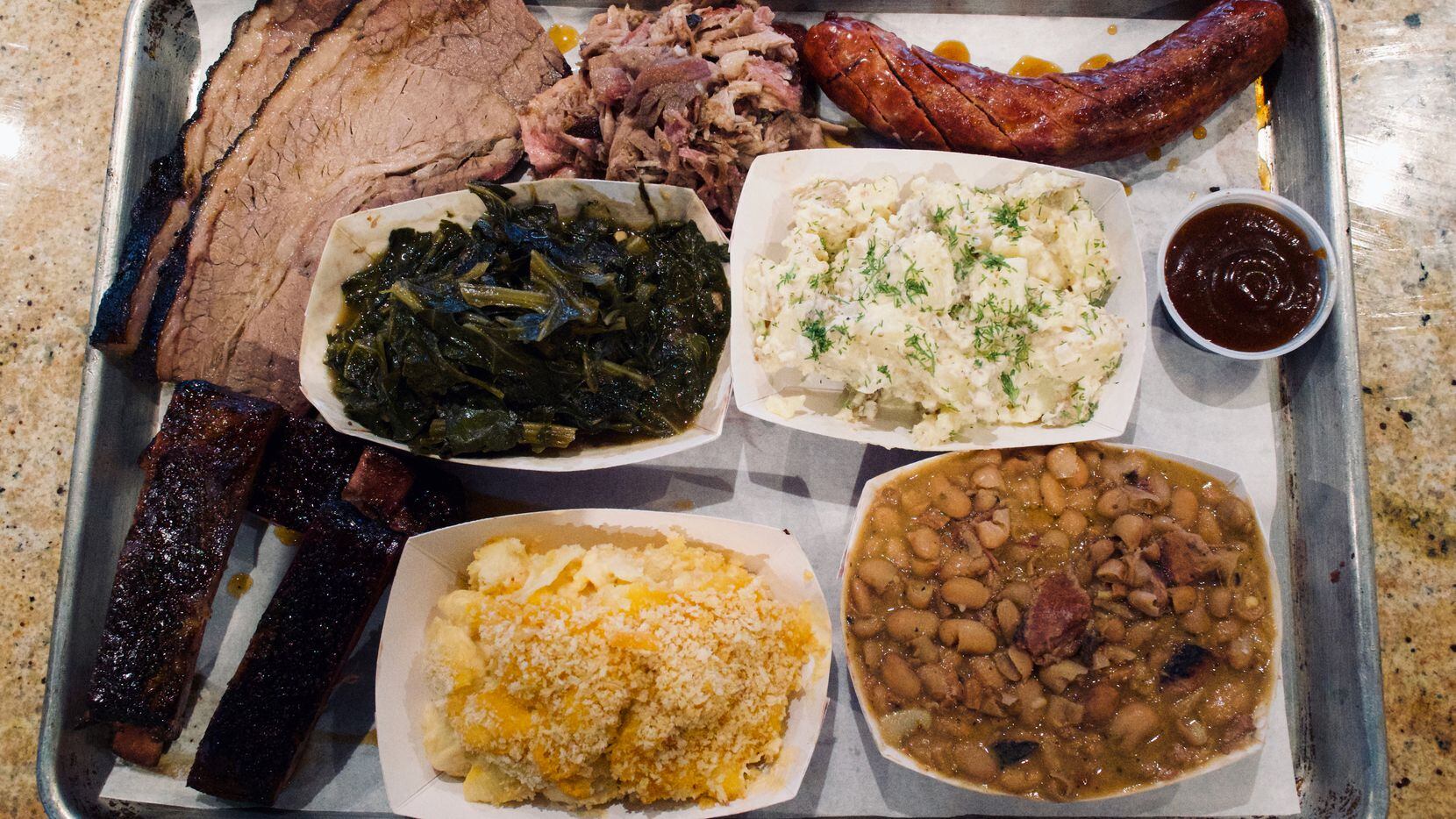 Smoked meat at 42 BBQ Smokehouse + Market can be ordered by the pound or on plates, with...