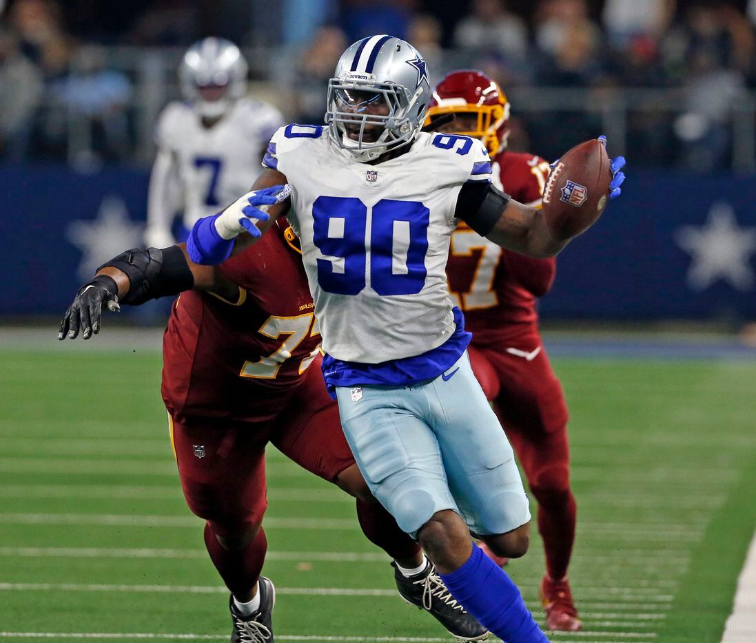 Dallas Cowboys defensive end Demarcus Lawrence (90) heads to the end zone for a touchdown,...