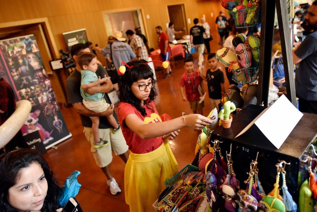 Jessica Trevizo, 29, wears El Chapulin Colorado costume during the Texas Latino Comic Con....