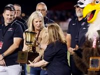 Argyle superintendent Dr. Telena Wright (center, right) receives the Class 4A UIL Lone Star...