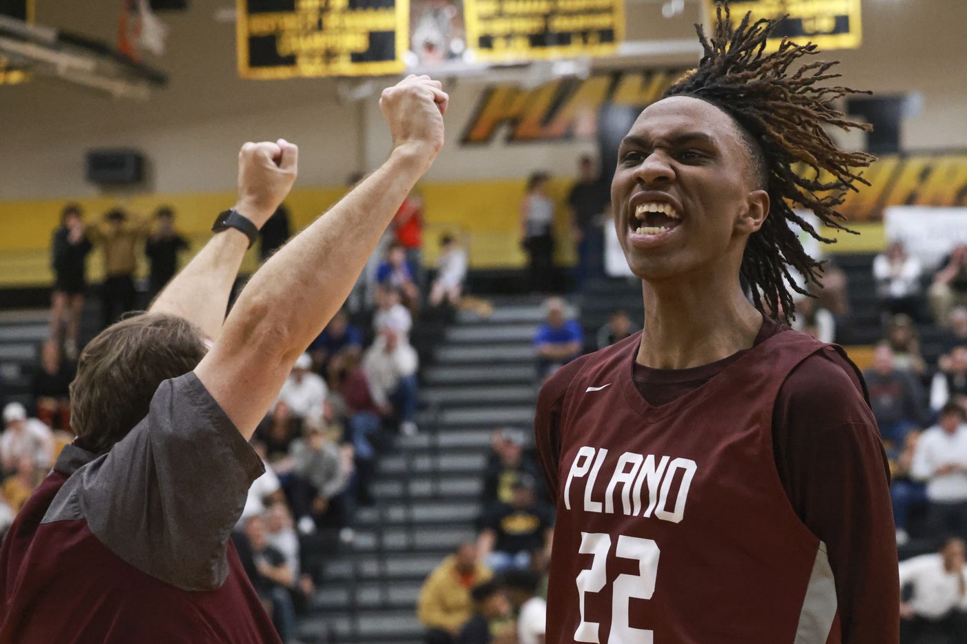 Plano Senior High School’s Nikk Williams (22) turns to the crowd cheering after Justin...