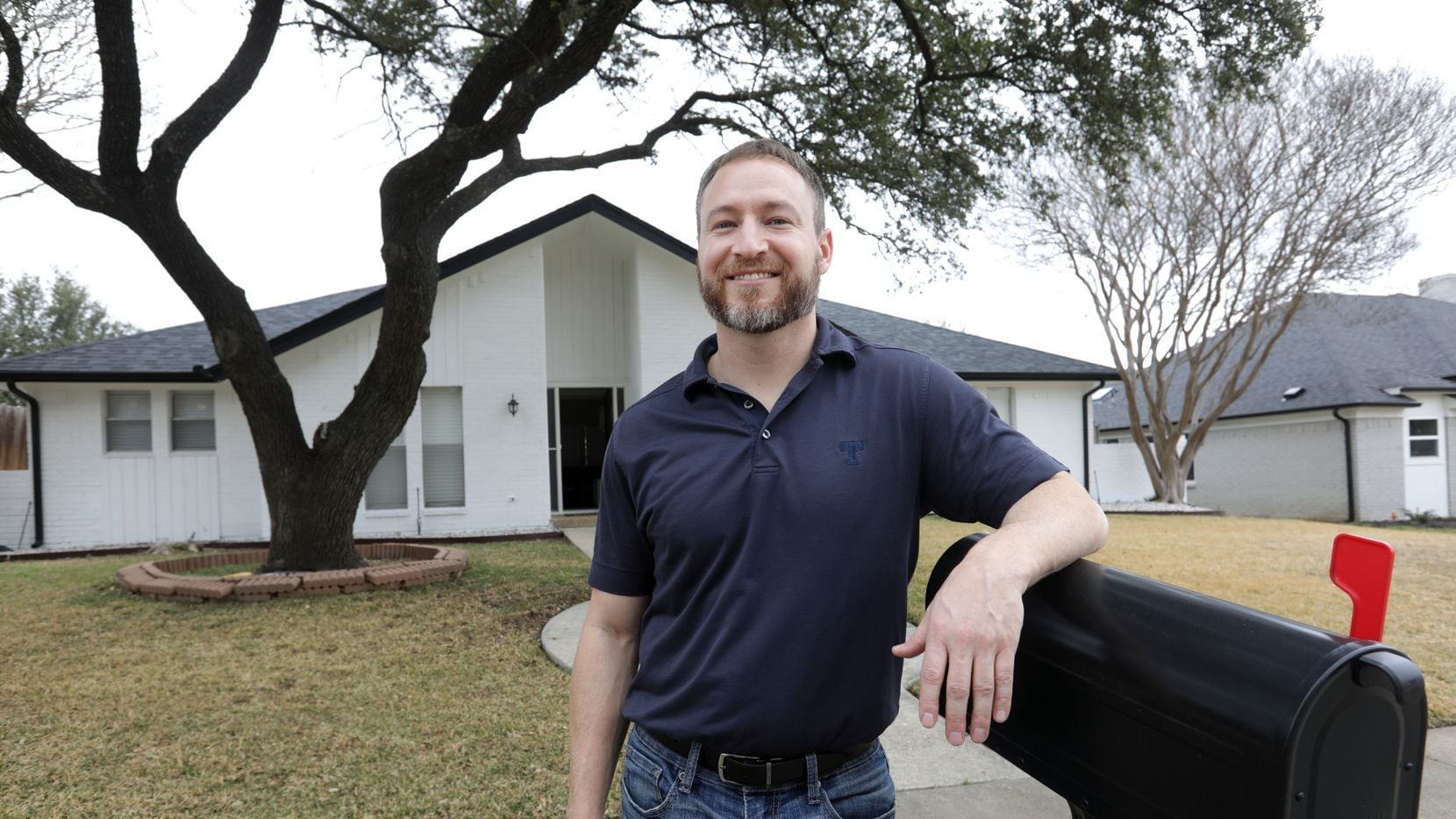 Airbnb host Scott Schober stands in front of one of his homes in Plano.