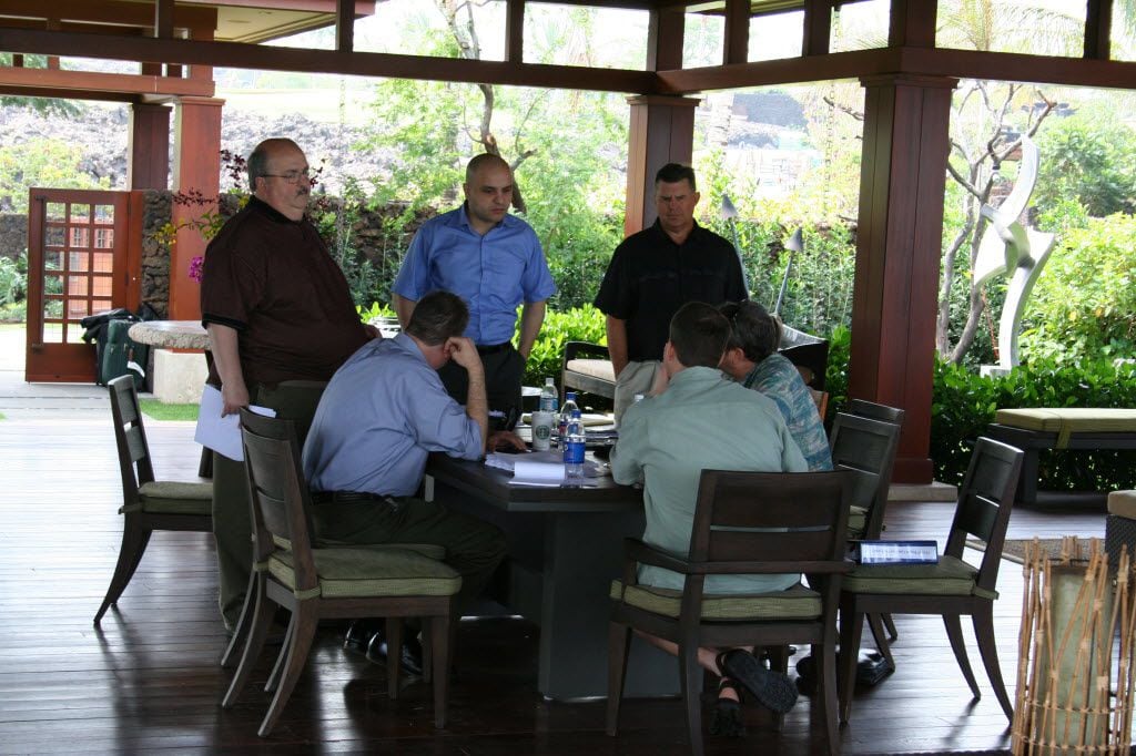 Tettamant (standing at left) at one of the fund's luxury homes in Hawaii in 2008. He and...