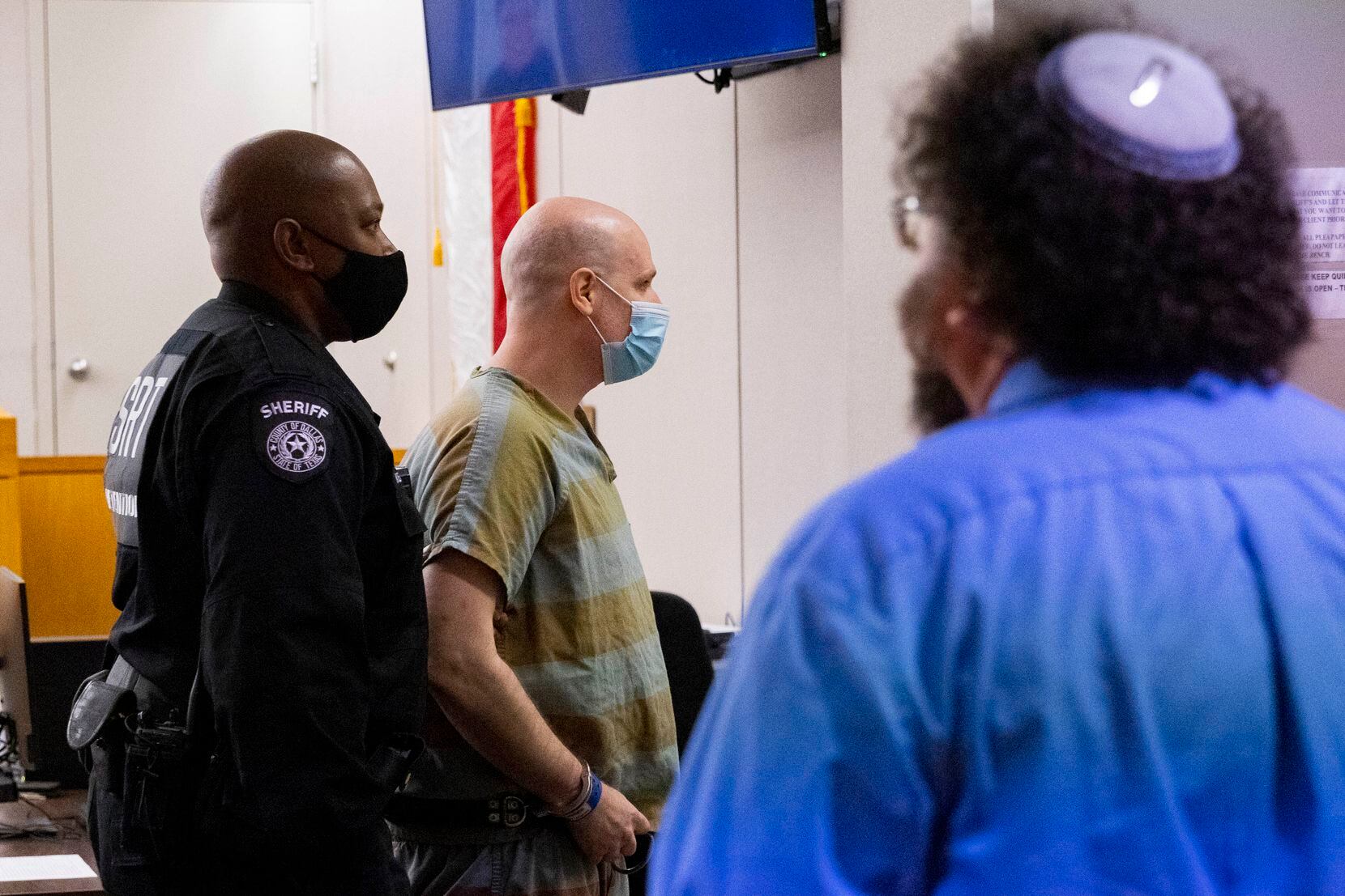 Randy Halprin, one of the Texas Seven prison escapees convicted in the murder of an Irving police officer, is escorted out of the 283rd Judicial District Court where lawyers argued whether the judge at his 2003 trial prejudiced the jury against him on Wednesday, July 14, 2021, at Frank Crowley Courthouse in Dallas. (Juan Figueroa/The Dallas Morning News)
