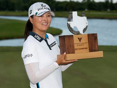 Professional golfer Jin Young Ko lifts the winner’s trophy after winning the LPGA VOA...