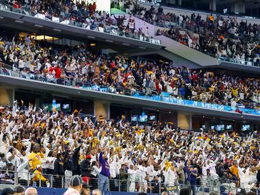 South Oak Cliff fans stand and cheer during the fourth quarter of their Class 5A Division II...
