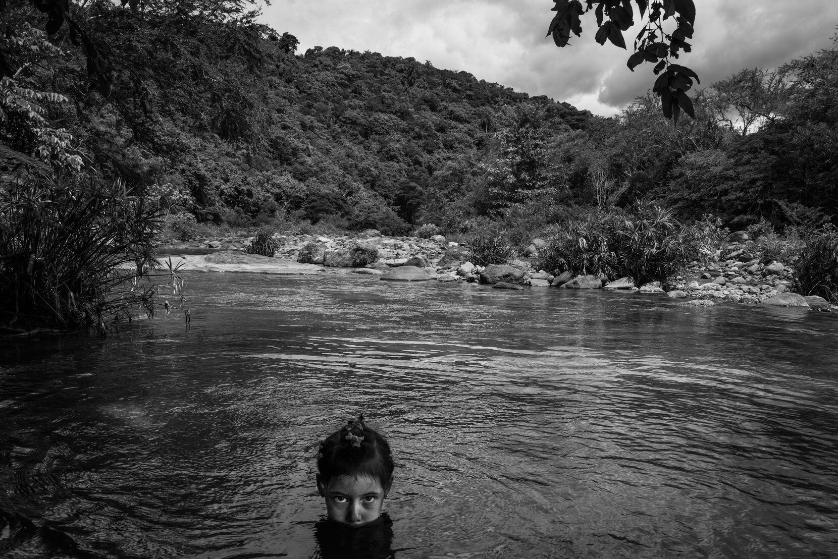 A child swims in the Yara River, near Cuba's Sierra Maestra mountain range.