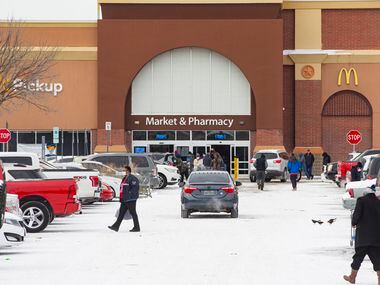 People outside of the Walmart in Arlington on Tuesday, Feb. 16, 2021. (Juan Figueroa/ The...