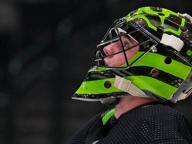 Dallas Stars goaltender Jake Oettinger looks up during a time out in the second period of an...