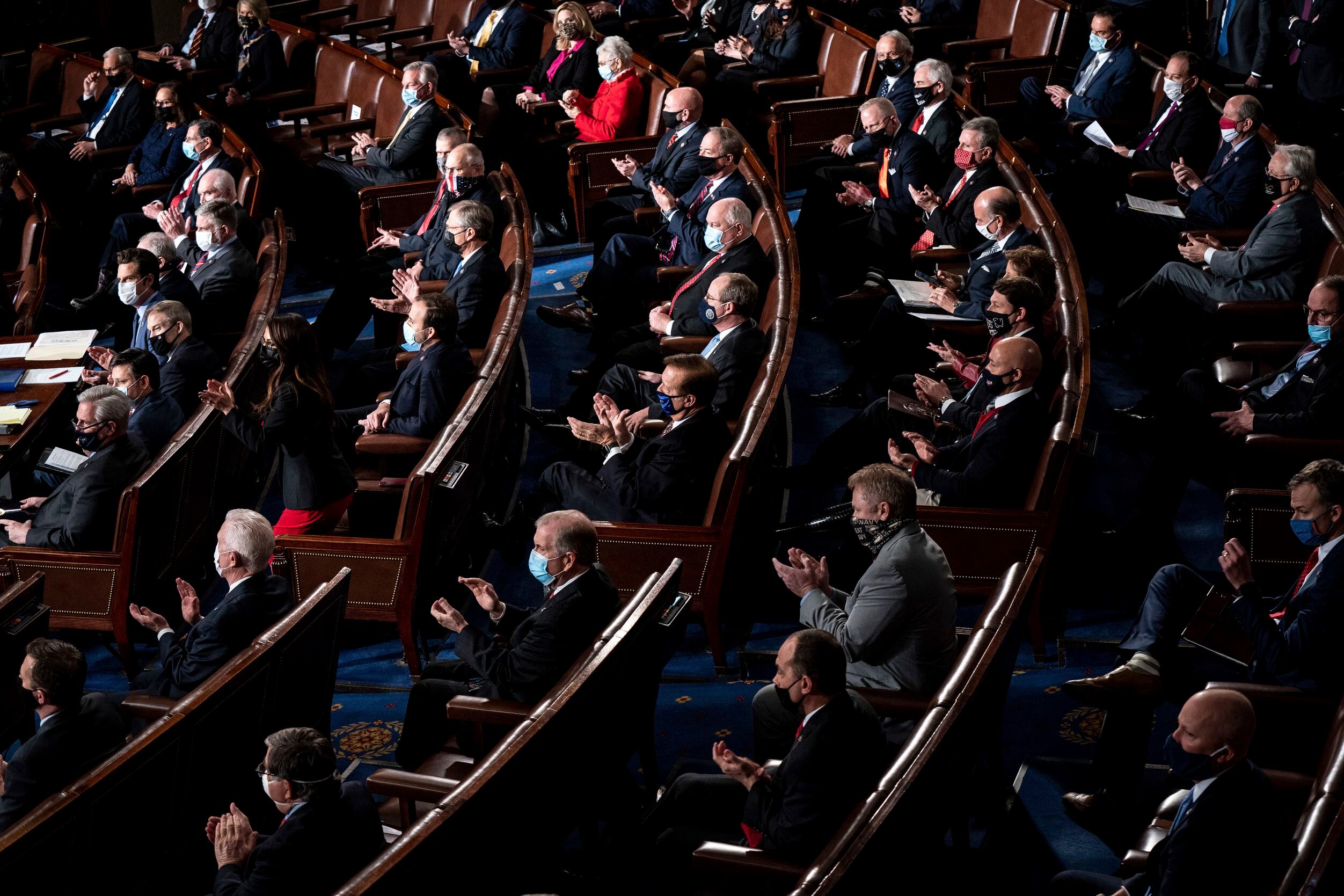 Republican members of the Congress clap as a joint session of the House and Senate convenes...