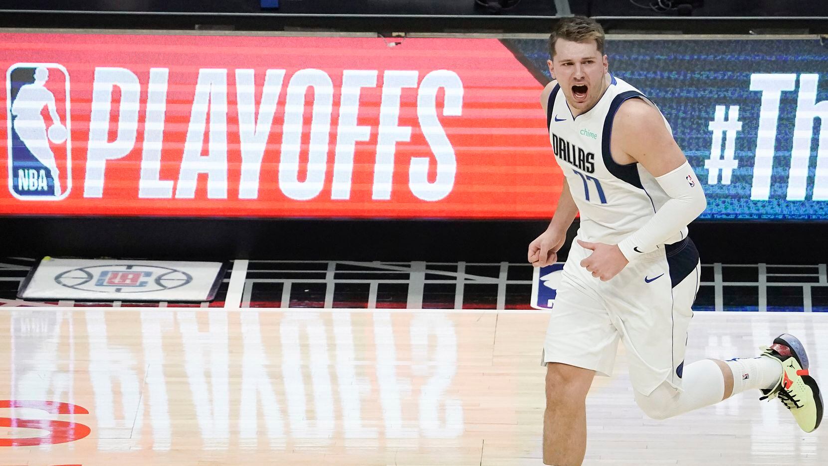 Dallas Mavericks guard Luka Doncic (77) celebrates a made basket during the first half of an NBA playoff basketball game against the LA Clippers at Staples Center on Saturday, May 22, 2021, in Los Angeles. 