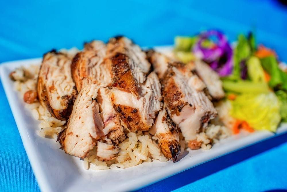 Renee's Jerk Chicken is located in the parking lot of In-Fretta Pizza and Wings in Plano at 5588 Texas Highway 121, Suite 300.