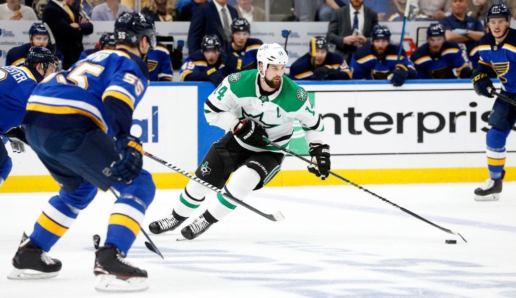 Dallas Stars left wing Jamie Benn (14) controls the puck against the St. Louis Blues during...
