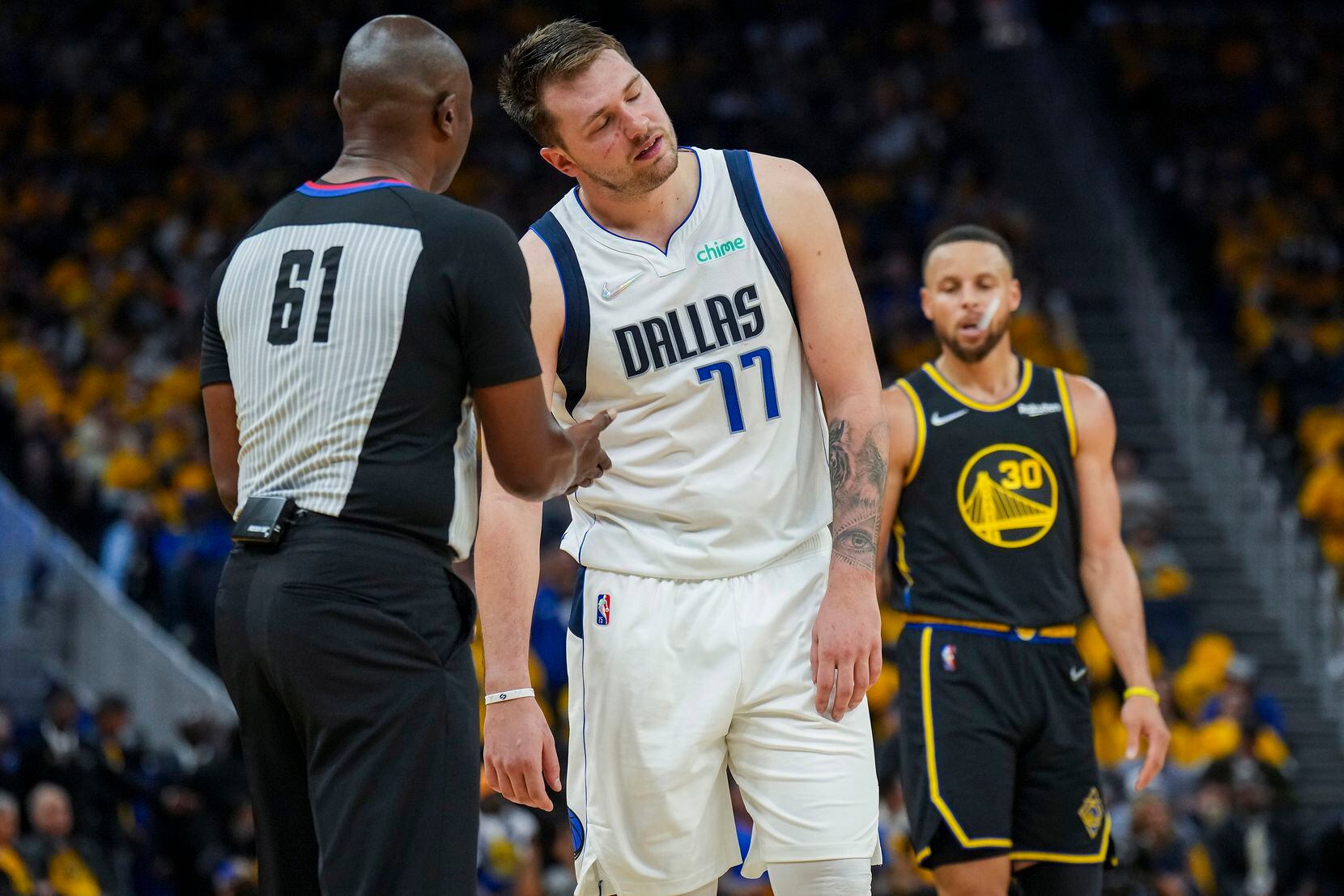 Dallas Mavericks guard Luka Doncic (77) reacts after a call went against him during the...