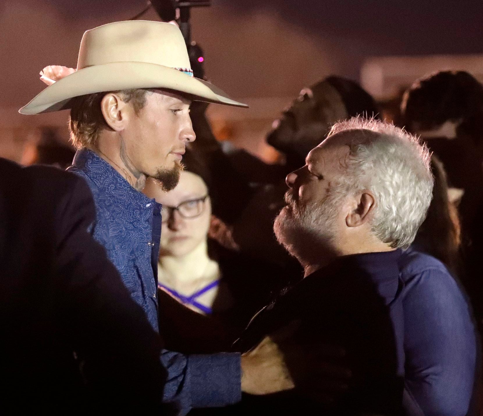 Stephen Willeford, right, hugs Johnnie Langendorff during a vigil for the victims of the First Baptist Church shooting Monday, Nov. 6, 2017, in Sutherland Springs, Texas. 