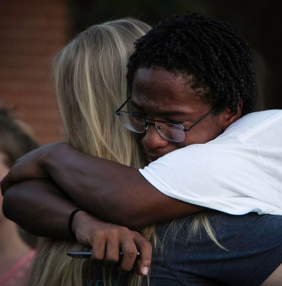Lafayette Armstrong hugs his friends during a prayer vigil held in honor of Kaytlynn Cargill at Central Junior High School in Euless, Texas on June 22, 2017.