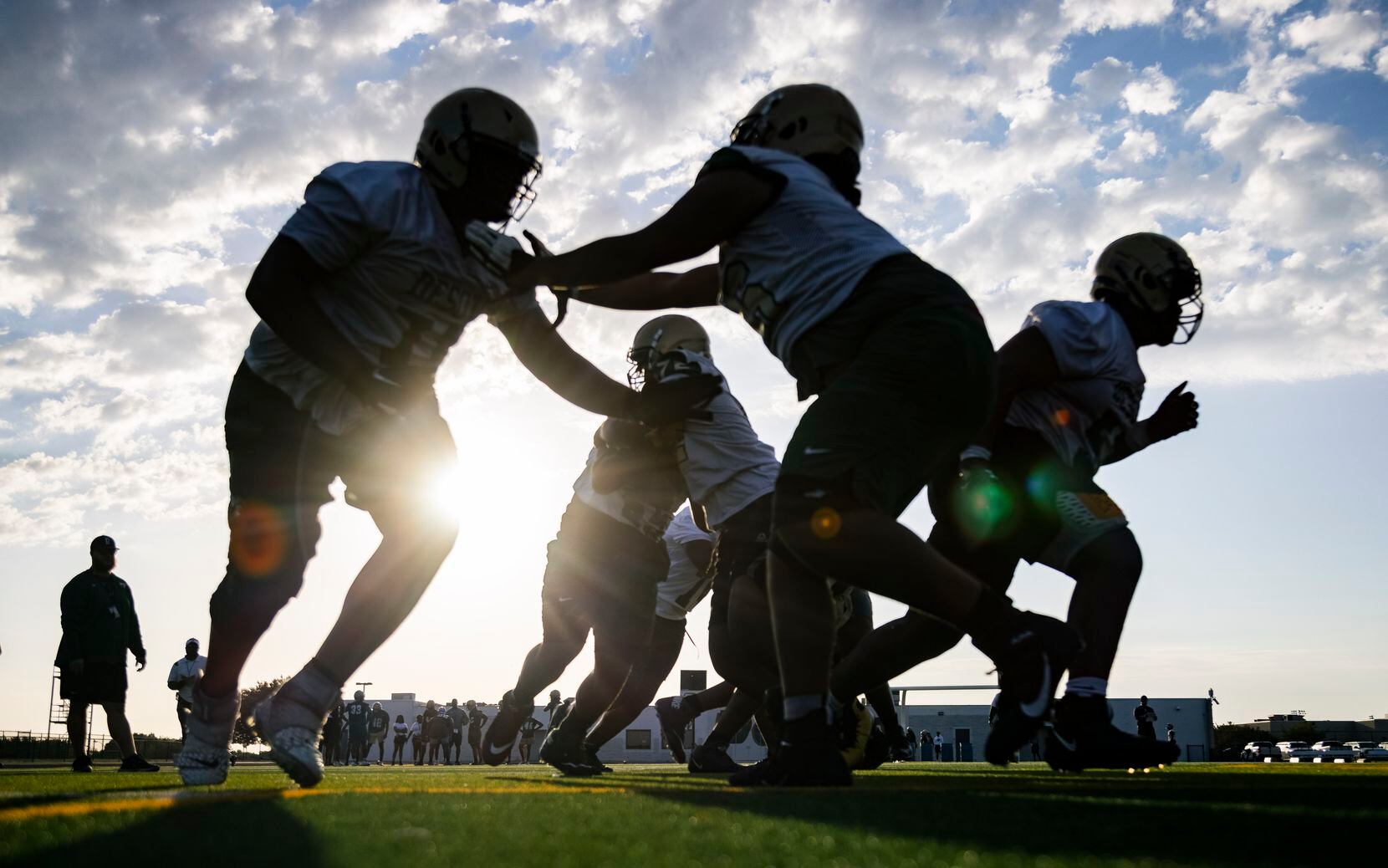 DeSoto football players run drills during the first practice of the season on Monday, Aug....