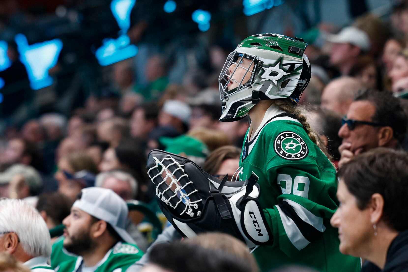 A young Dallas Stars fan watches during the third period of a game against the Vegas Golden...