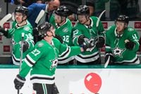 Dallas Stars left wing Mason Marchment (left) celebrates with teammates after scoring to tie...