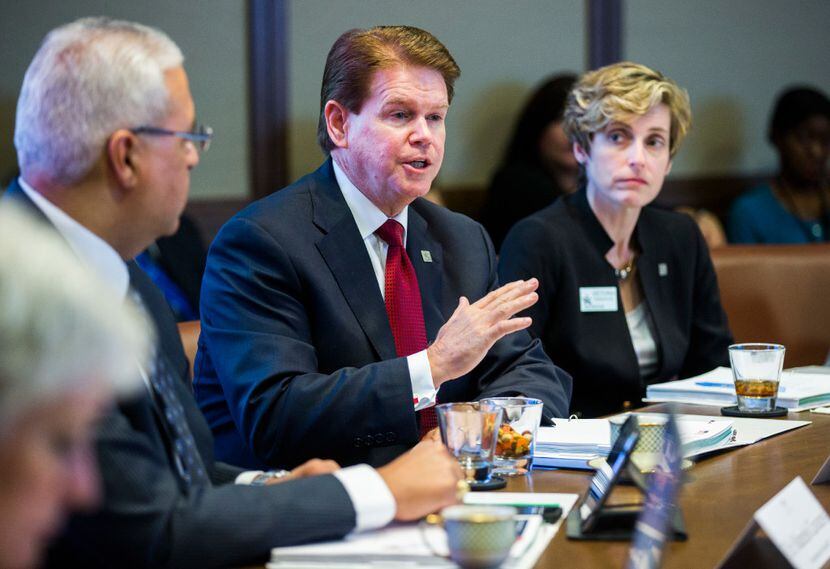 Arlington Mayor Jeff Williams (center) wooed business owners and community groups to back...