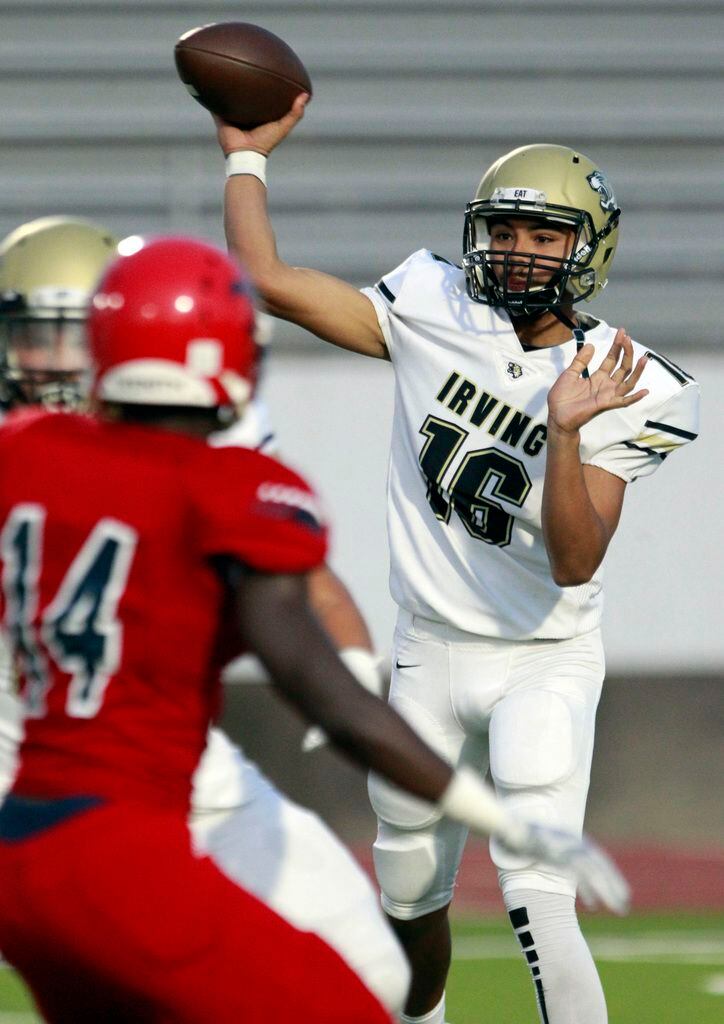 Irving High QB Adrian Medina (16) throws a pass during the first half of the Irving Vs....