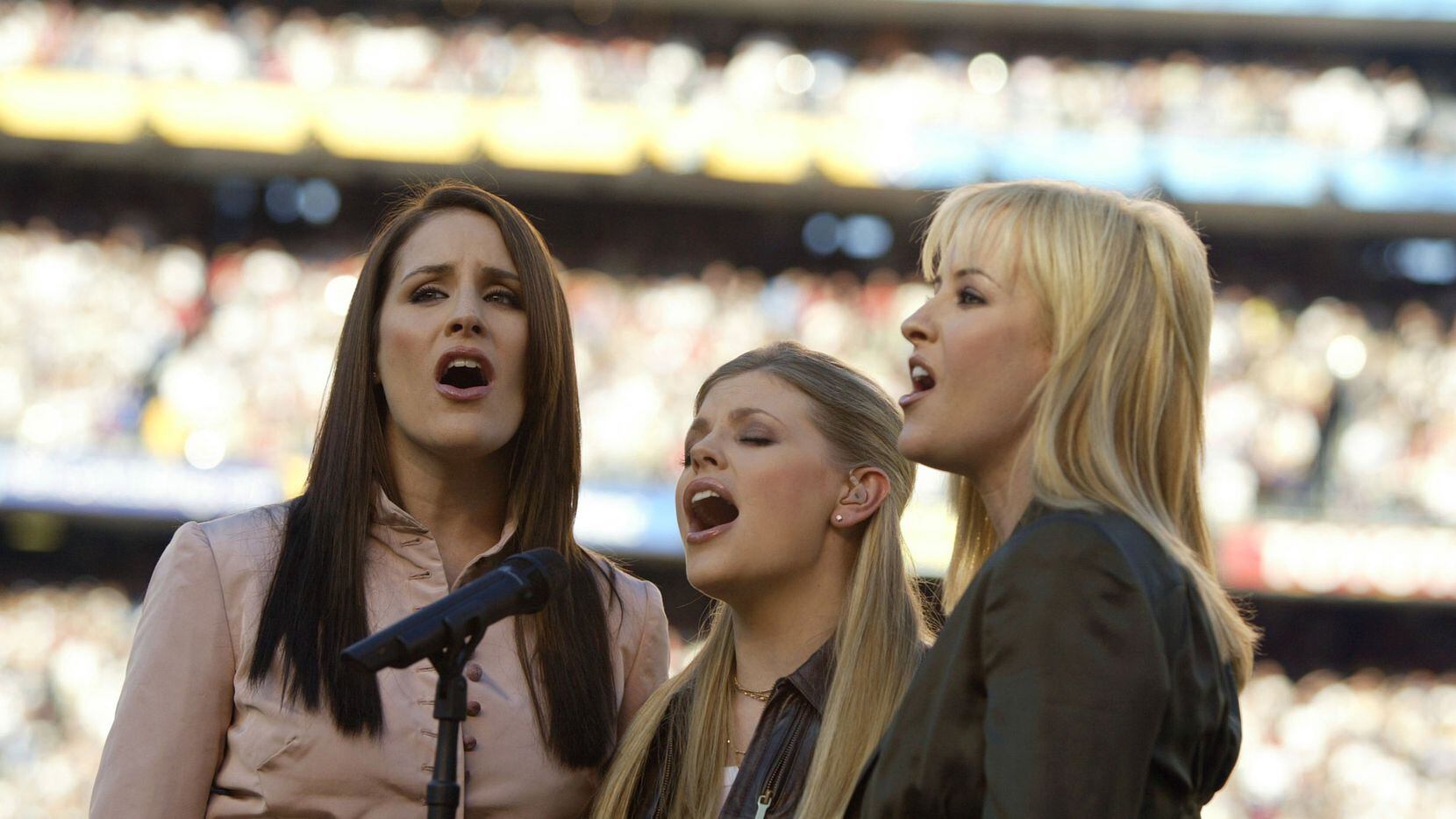 The Dixie Chicks perform the national anthem before the start of Super Bowl XXXVII between...