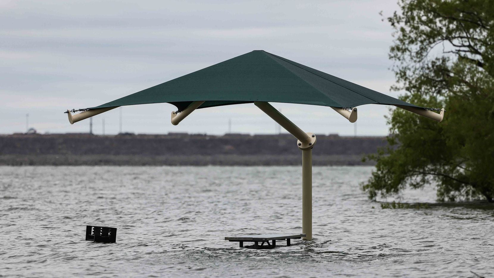 The water level at Grapevine Lake came up to the level of grills along the lake earlier this month. (Lola Gomez/The Dallas Morning News)
