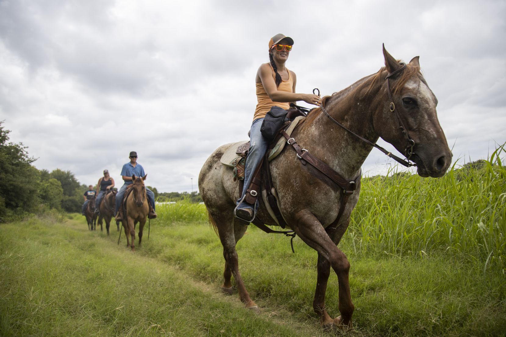 Riders celebrate a friend's birthday by having a ride through the equestrian trail at Ray...