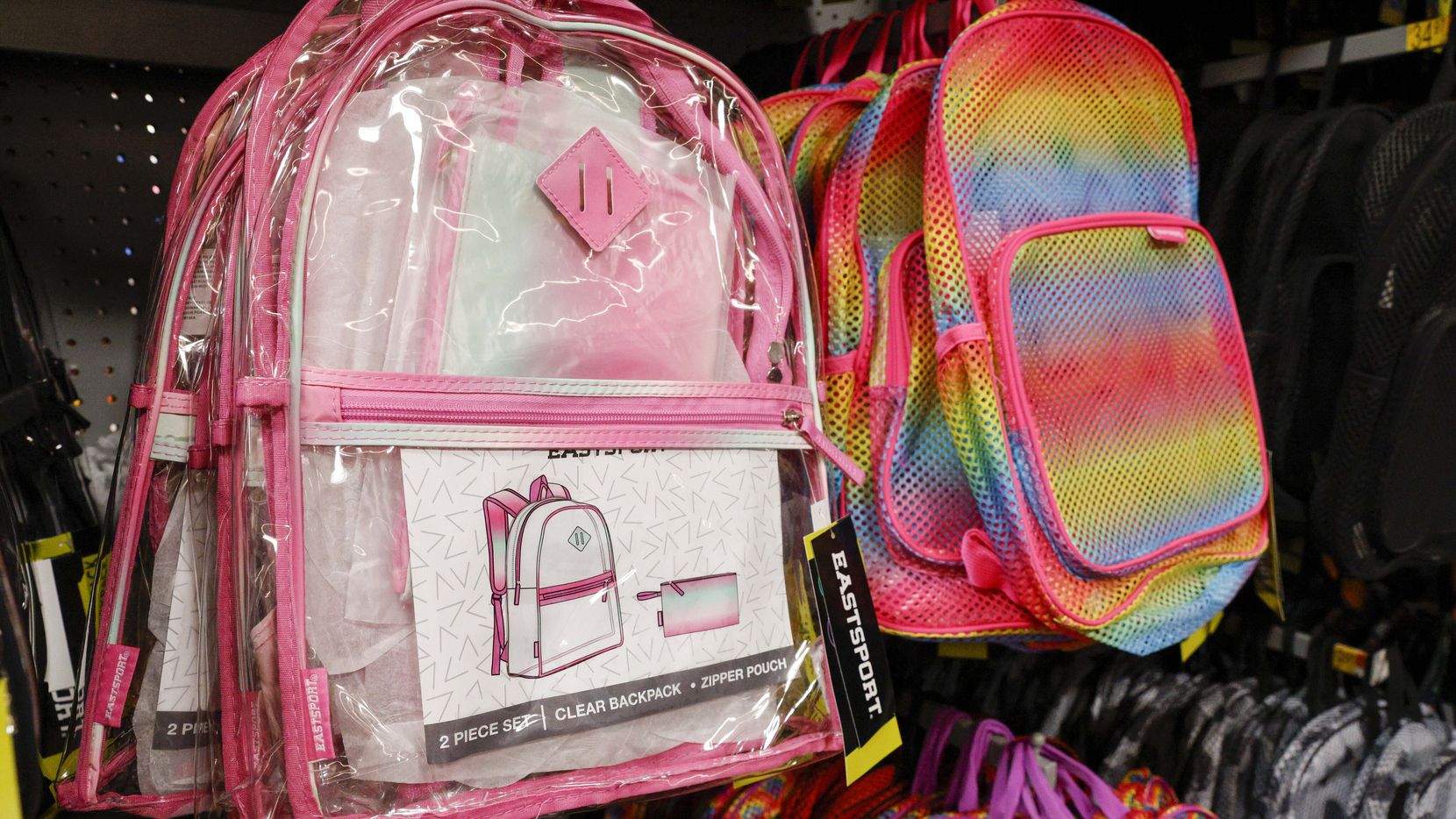 Clear and mesh backpacks priced at $11.89 each filledpart of an aisle of school supplies at...