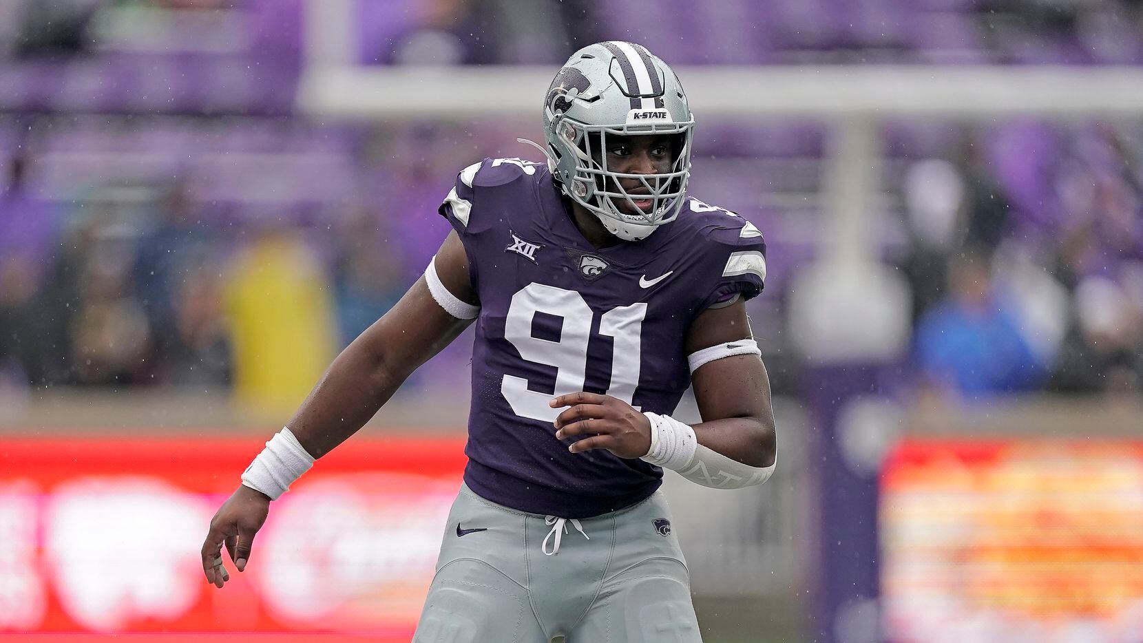 FILE - Kansas State defensive end Felix Anudike-Uzomah gets into position during the first...