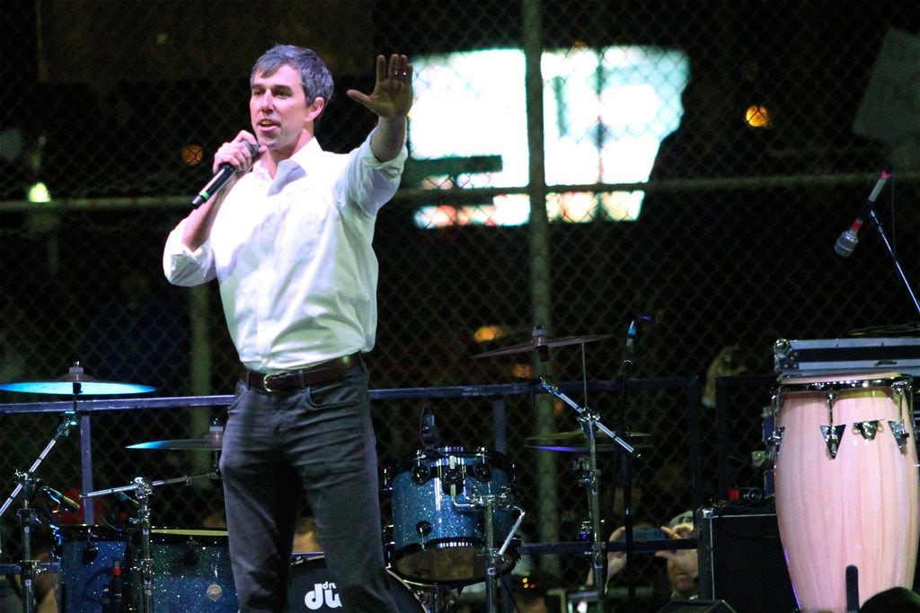 Former Democratic Rep. Beto O'Rourke speaks to a crowd inside a ball park across the street...