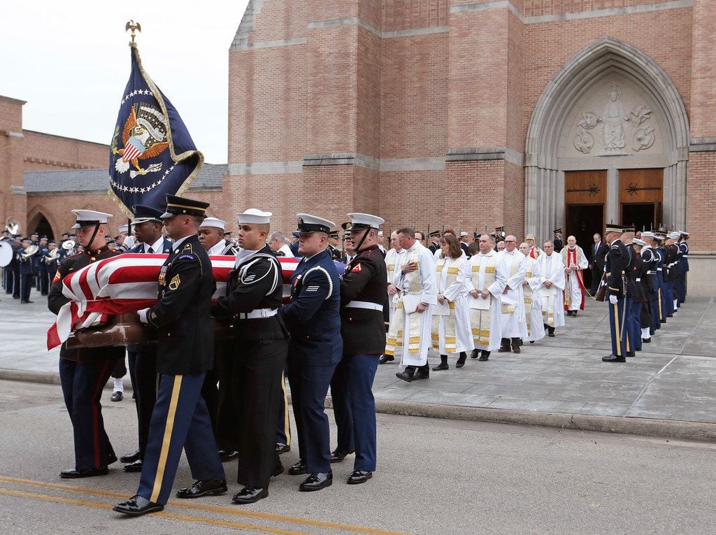 Pallbearers carry the casket at the state funeral service for George H.W. Bush, the 41st...