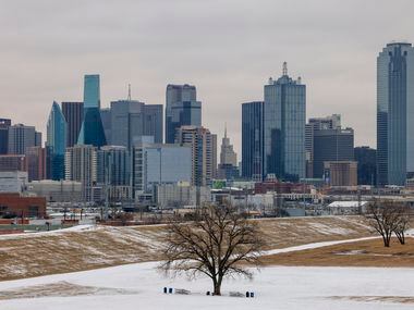 Snow and ice covers Trammell Crow Park near downtown Dallas on Thursday, Feb. 3, 2022....