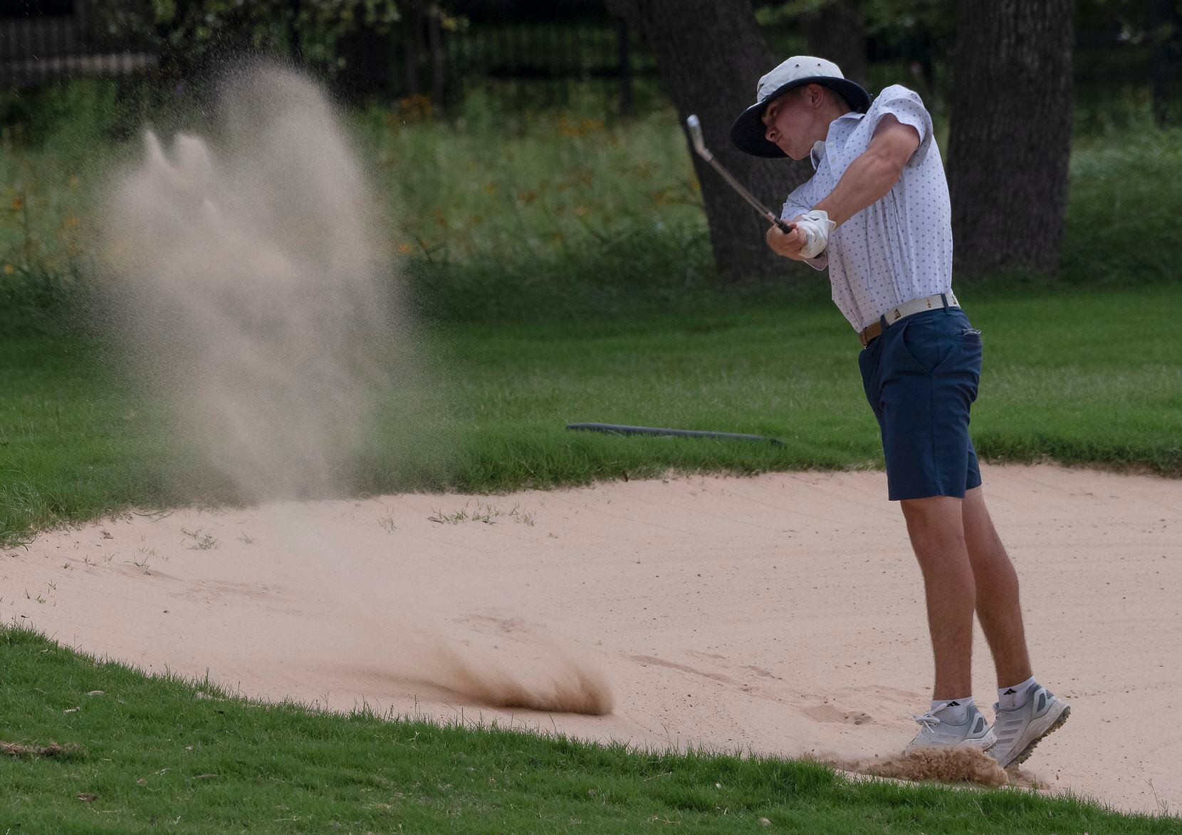 Keller Kaelen Dulany, hits out of a fairway bunker on the 18th hole during the UIL Class 6A...